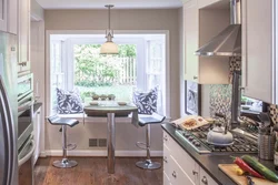 Kitchen Design With A Table By The Window Photo