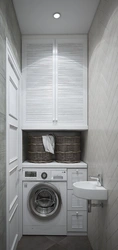 Photo of bathroom cabinets above the washing machine