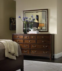 Bedroom design with chest of drawers and mirror