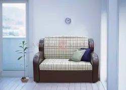 Small sofa with sleeping place in the room photo