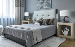 Bedroom interior with gray wallpaper and brown furniture