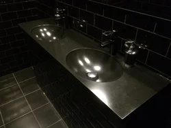 Black countertop in the bathroom photo