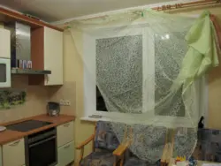 Mesh curtains in the kitchen interior