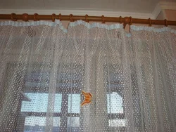Mesh curtains in the kitchen interior