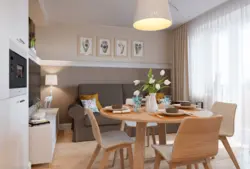 Photo of a living room kitchen with a sofa at the table