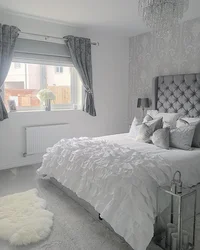 Bedroom design with gray bed and gray curtains