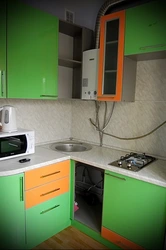 Corner kitchen with gas water heater photo