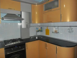 Corner kitchen with gas water heater photo
