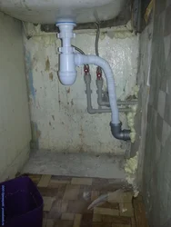 Sewer pipe in the kitchen photo
