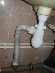 Sewer pipe in the kitchen photo