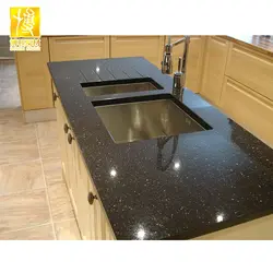 Black glossy countertop in the kitchen photo