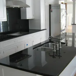 Black Glossy Countertop In The Kitchen Photo