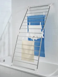 Wall-mounted dryer in the bathroom interior