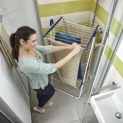 Wall-Mounted Dryer In The Bathroom Interior