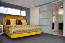 Yellow bed in the bedroom interior photo