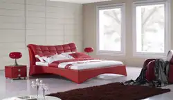 Red bed in the bedroom interior photo
