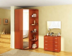 Small corner wardrobe in the bedroom for clothes photo