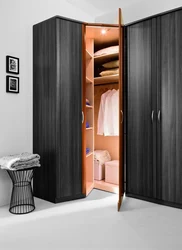Small corner wardrobe in the bedroom for clothes photo