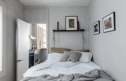 Bedroom design with a bed along the wall photo
