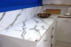 White granite countertop in the kitchen interior