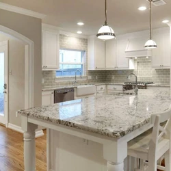 White granite countertop in the kitchen interior