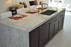 White granite countertop in the kitchen interior