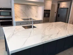 White granite countertop in the kitchen interior