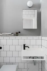 White Bathtub With Black Grout Photo
