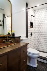 White bathtub with black grout photo