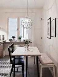 Photo of a small kitchen with a dining table