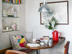 Photo Of A Small Kitchen With A Dining Table