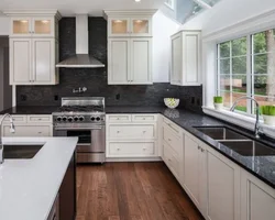 Kitchen with a gray countertop and apron in the interior photo