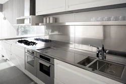 Kitchen with a gray countertop and apron in the interior photo