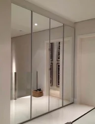 Built-in wardrobe in the hallway photo with mirrors