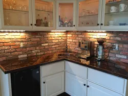 Photo of kitchen with stone panels