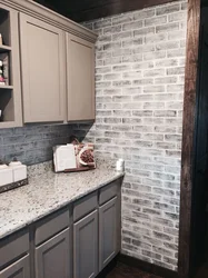 Photo of kitchen with stone panels