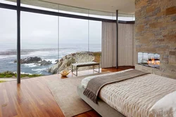 Bedroom design with panoramic windows in an apartment