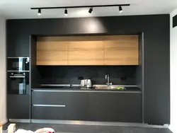 Design of a straight kitchen in a modern style with a refrigerator