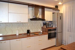 Straight kitchen design with refrigerator on the right
