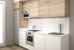 Straight kitchen design with refrigerator on the right