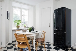 Black refrigerator in the kitchen interior photo how