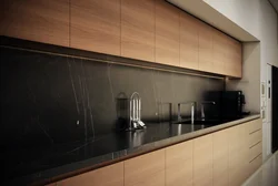 Photos of kitchens with dark panels