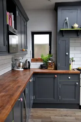 Photo of a gray kitchen combined with wood