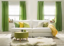 Curtains in the living room with a green sofa photo