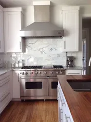 Kitchen design with full-wall hood