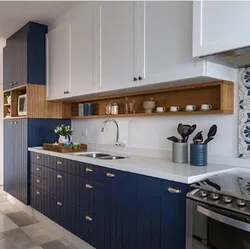 Blue kitchen in the interior photo with wooden