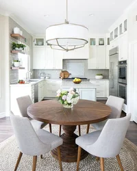 Kitchen with white round table photo