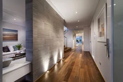 Hallway design in an apartment with laminate flooring on the wall