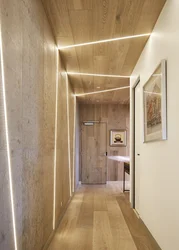 Hallway Design In An Apartment With Laminate Flooring On The Wall