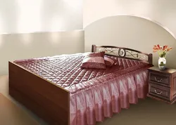 Bed With A Blanket In The Bedroom Interior